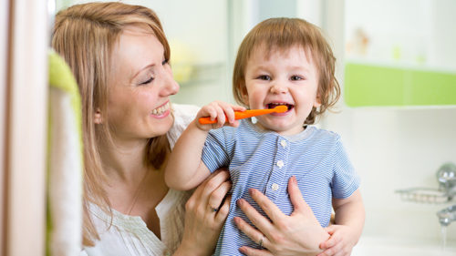 Smiling child with his mother