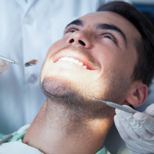 A man receiving a dental exam